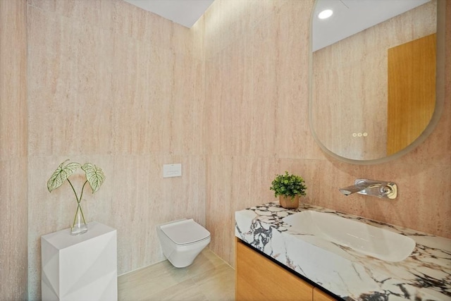 bathroom with vanity, tile patterned flooring, and toilet