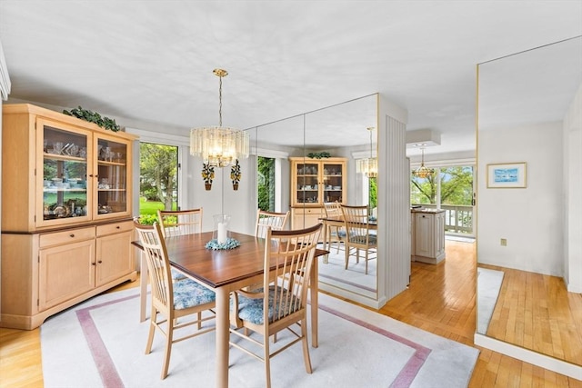 376 Flint St, Barnstable, MA 02648 - dining room with a chandelier, plenty of natural light, and light wood-type flooring