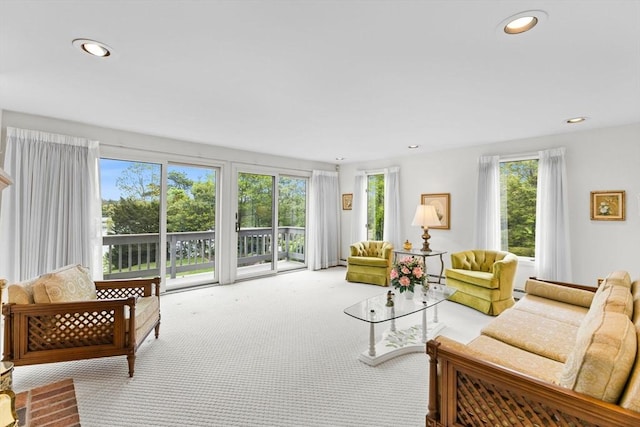 376 Flint St, Barnstable, MA 02648 - carpeted living room with recessed lighting, a baseboard heating unit, and a baseboard radiator