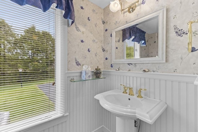 376 Flint St, Barnstable, MA 02648 - bathroom with a wainscoted wall, wallpapered walls, and a sink