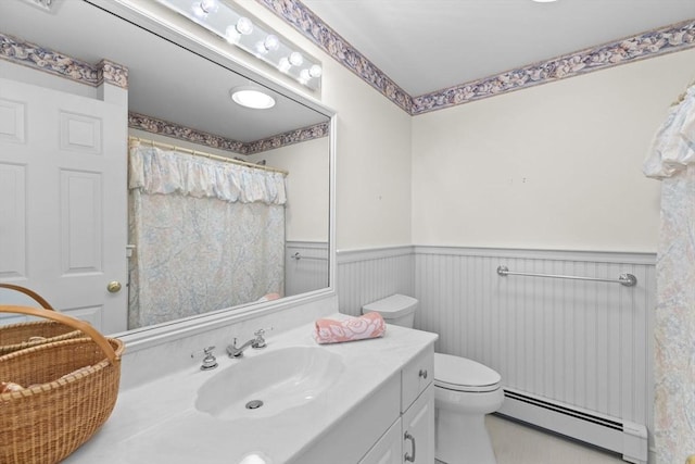 376 Flint St, Barnstable, MA 02648 - bathroom with a baseboard radiator, wainscoting, vanity, toilet, and a shower with shower curtain