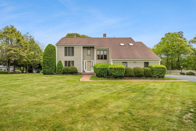376 Flint St, Barnstable, MA 02648 - view of front of home featuring a chimney and a front yard