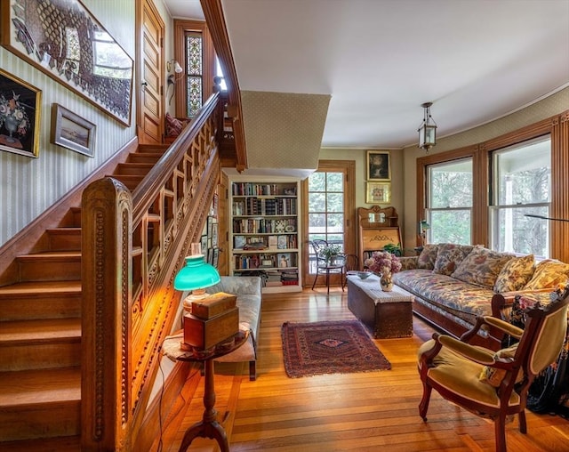 living room with wood finished floors and stairs