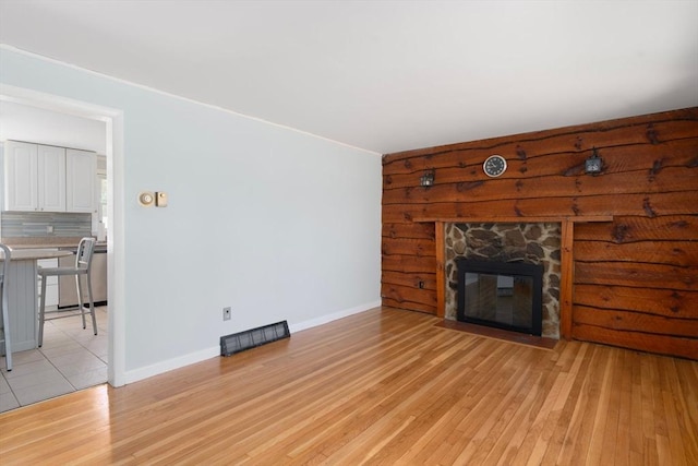 25 Watson St, Seekonk, MA 02771 - unfurnished living room with light wood-style floors, a fireplace, and baseboards