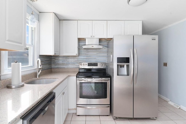 25 Watson St, Seekonk, MA 02771 - kitchen featuring stainless steel appliances, wall chimney range hood, a sink, light tile patterned flooring, and light stone countertops