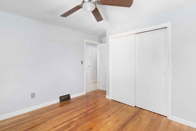 25 Watson St, Seekonk, MA 02771 - unfurnished bedroom with light wood finished floors, baseboards, a closet, and ceiling fan