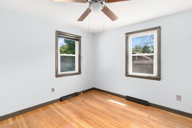 25 Watson St, Seekonk, MA 02771 - unfurnished room with healthy amount of natural light, baseboards, light wood-style flooring, and a ceiling fan
