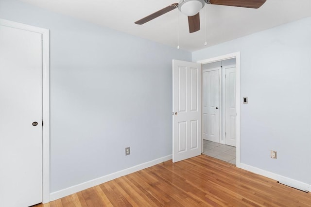25 Watson St, Seekonk, MA 02771 - unfurnished bedroom with light wood finished floors, baseboards, and a ceiling fan