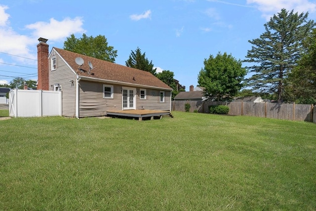 25 Watson St, Seekonk, MA 02771 - rear view of house featuring french doors, a deck, and a chimney