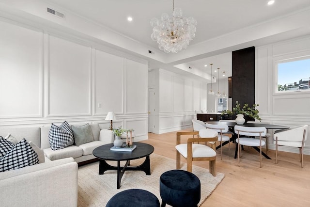 9 Russell Unit 2, Boston, MA 02129 - living area featuring a decorative wall, a chandelier, light wood-type flooring, recessed lighting, and ornamental molding