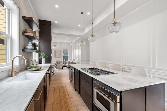 9 Russell Unit 2, Boston, MA 02129 - kitchen with a decorative wall, a sink, open shelves, stainless steel appliances, and plenty of natural light