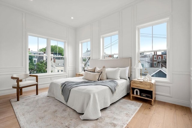 9 Russell Unit 2, Boston, MA 02129 - bedroom with a decorative wall, light wood finished floors, and ornamental molding