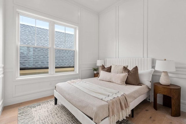 9 Russell Unit 2, Boston, MA 02129 - bedroom featuring a decorative wall, light wood-type flooring, and ornamental molding