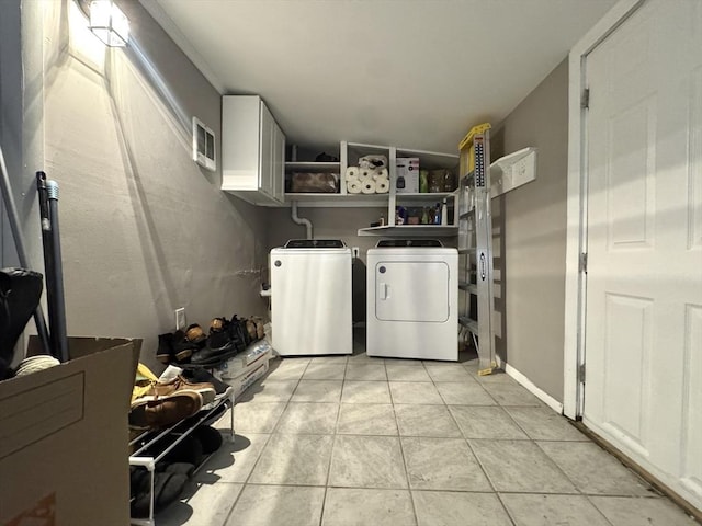 11 Marie Ave, Brockton, MA 02302 - laundry area with separate washer and dryer, cabinet space, and light tile patterned floors