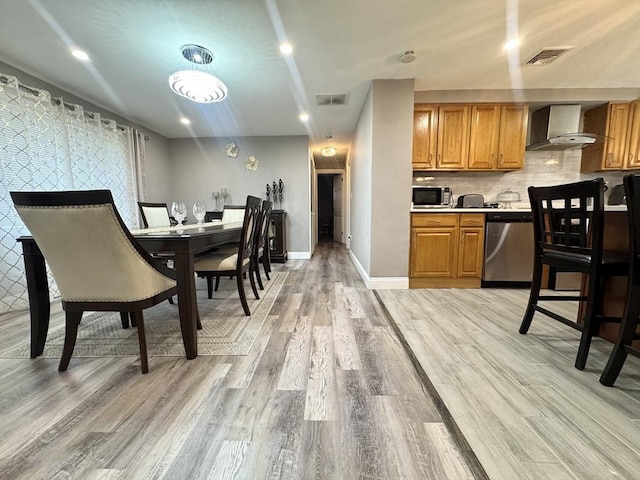 11 Marie Ave, Brockton, MA 02302 - dining room with light wood-type flooring and baseboards