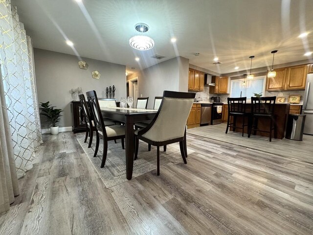 11 Marie Ave, Brockton, MA 02302 - dining space with light wood-type flooring and baseboards