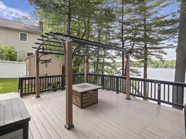 34 Lake Shore Dr S, Westford, MA 01886 - wooden deck with a water view and an outdoor fire pit