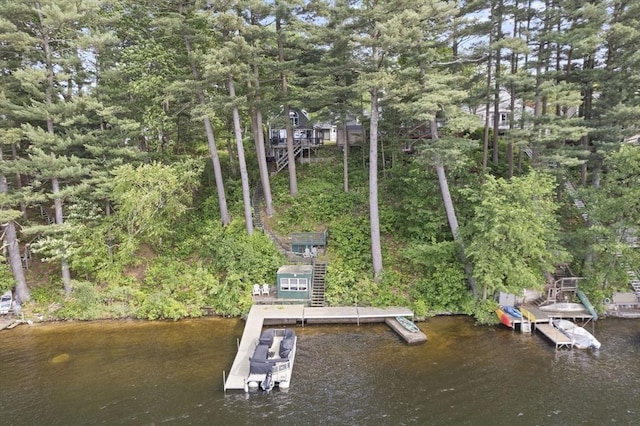 34 Lake Shore Dr S, Westford, MA 01886 - dock featuring a water view, view of wooded area, and stairway