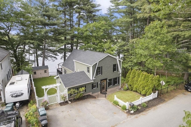 34 Lake Shore Dr S, Westford, MA 01886 - view of front of house featuring roof with shingles and view of scattered trees
