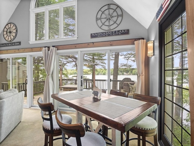 34 Lake Shore Dr S, Westford, MA 01886 - carpeted dining room featuring a water view, high vaulted ceiling, and healthy amount of natural light