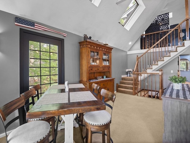 34 Lake Shore Dr S, Westford, MA 01886 - dining area featuring carpet floors, stairs, a skylight, and high vaulted ceiling