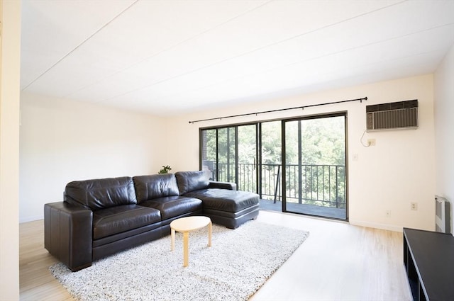 235 Winthrop St Unit 4407, Medford, MA 02155 - living room with a wall mounted air conditioner and wood finished floors