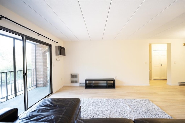 235 Winthrop St Unit 4407, Medford, MA 02155 - living room featuring light wood-type flooring, an AC wall unit, a baseboard radiator, and heating unit
