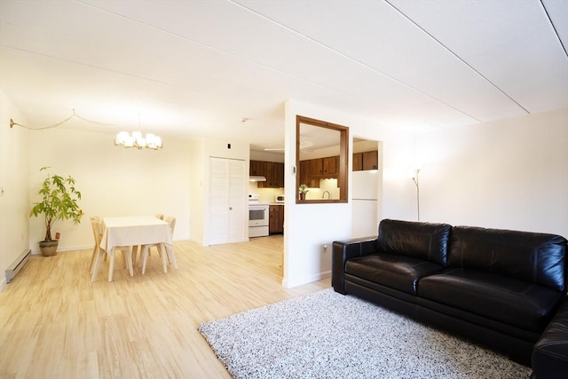 235 Winthrop St Unit 4407, Medford, MA 02155 - living room featuring baseboard heating, a chandelier, and light wood finished floors