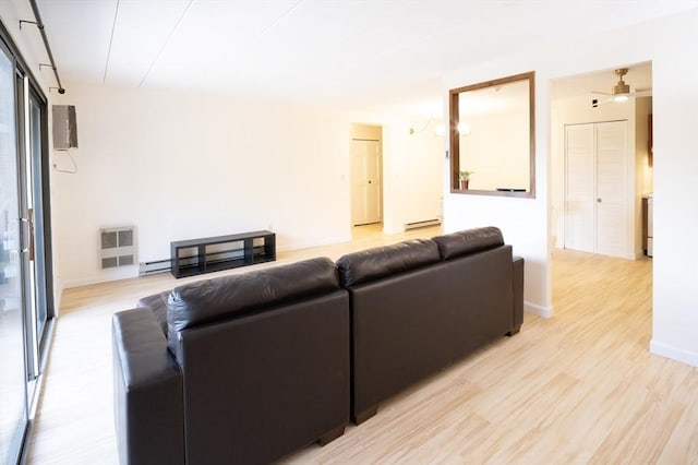 235 Winthrop St Unit 4407, Medford, MA 02155 - living area featuring light wood finished floors, a ceiling fan, and heating unit