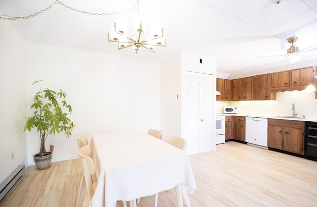 235 Winthrop St Unit 4407, Medford, MA 02155 - dining room with a baseboard heating unit, light wood-type flooring, a chandelier, and wine cooler