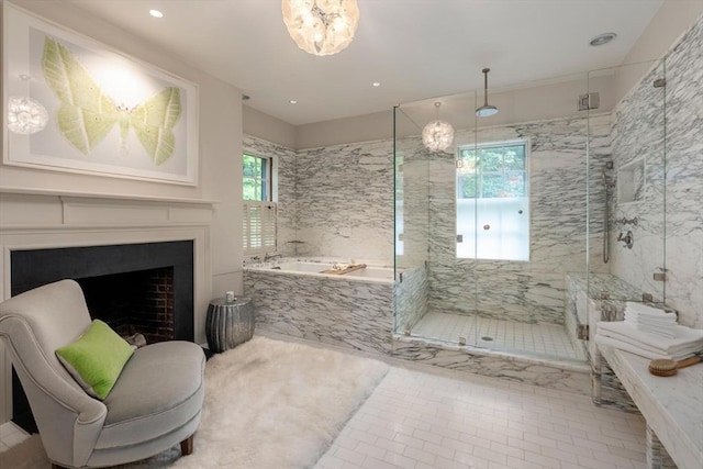 bathroom with plus walk in shower, tile patterned floors, and a wealth of natural light