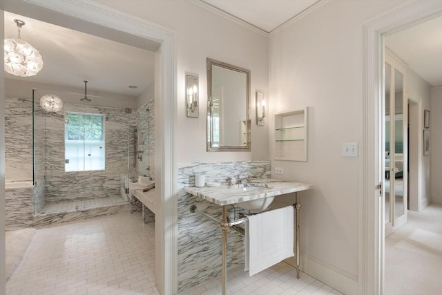 bathroom featuring a tile shower and crown molding