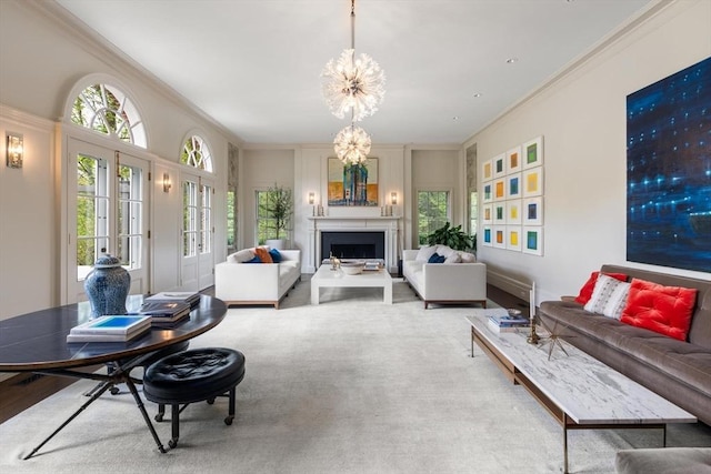 living room with a chandelier and crown molding