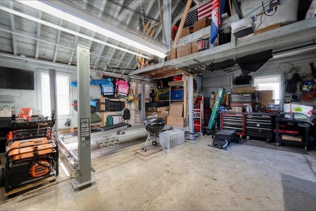 garage featuring a workshop area and a garage door opener