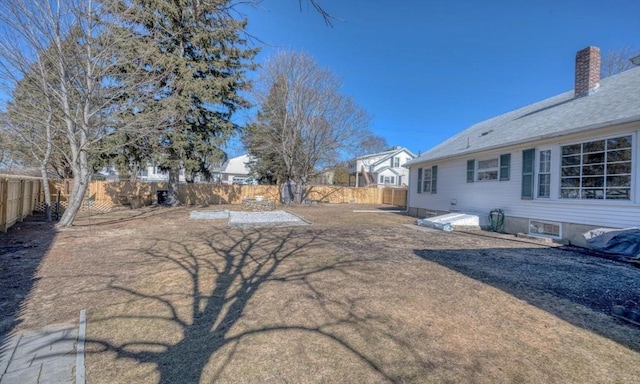 view of yard with a fenced backyard