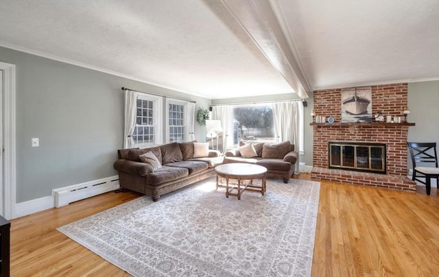 living area featuring baseboards, ornamental molding, wood finished floors, a brick fireplace, and a baseboard heating unit