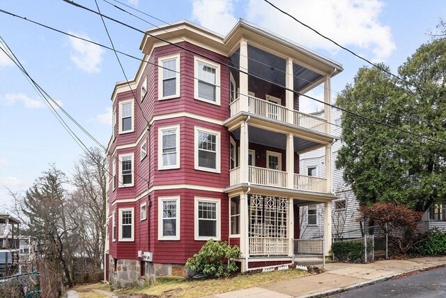 view of front facade featuring a balcony and a porch