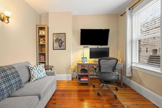 office space with baseboards and hardwood / wood-style floors