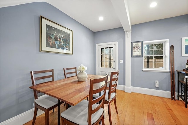 dining room with recessed lighting, baseboards, and light wood-type flooring