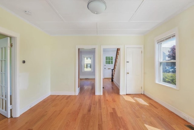 28 Sterling St, Weymouth, MA 02188 - spare room with healthy amount of natural light, light wood-type flooring, baseboards, and a smoke detector