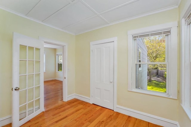 28 Sterling St, Weymouth, MA 02188 - doorway featuring ornamental molding, light wood finished floors, and baseboards