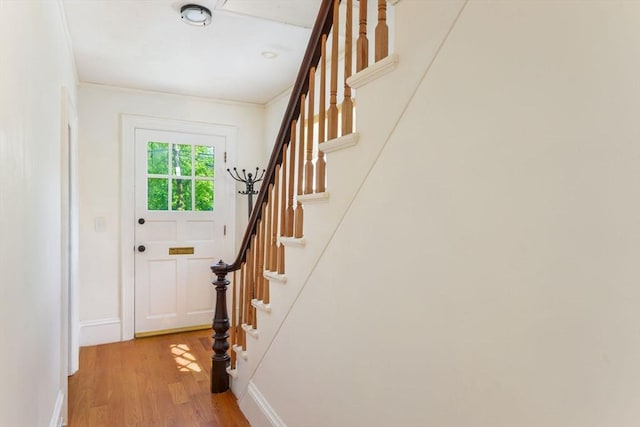 28 Sterling St, Weymouth, MA 02188 - doorway featuring light wood-type flooring, stairs, and baseboards