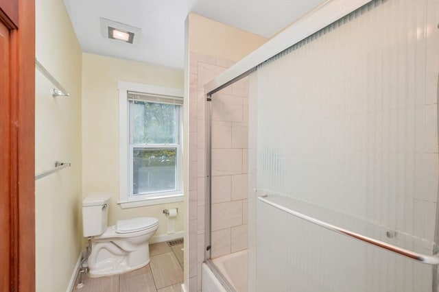 28 Sterling St, Weymouth, MA 02188 - full bathroom featuring toilet, tile patterned flooring, bath / shower combo with glass door, and baseboards