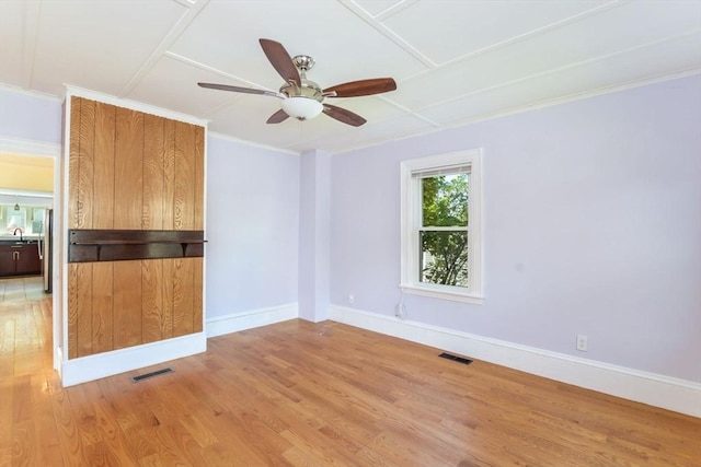 28 Sterling St, Weymouth, MA 02188 - unfurnished room featuring light wood-style flooring, a ceiling fan, baseboards, and crown molding