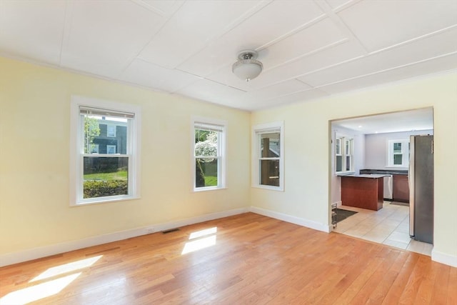 28 Sterling St, Weymouth, MA 02188 - unfurnished living room with light wood finished floors and baseboards