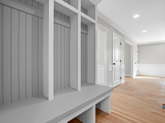 mudroom featuring crown molding and hardwood / wood-style flooring