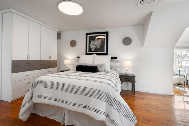 bedroom with light hardwood / wood-style floors