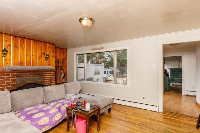 192 Sherbert Rd, Ashburnham, MA 01430 - living area with a fireplace, wood finished floors, and baseboard heating