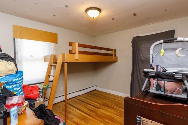 192 Sherbert Rd, Ashburnham, MA 01430 - bedroom with baseboards, wood finished floors, and baseboard heating