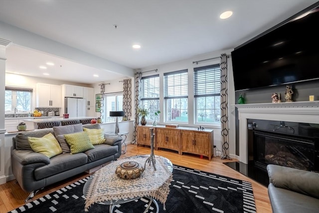living room featuring recessed lighting and light wood-type flooring